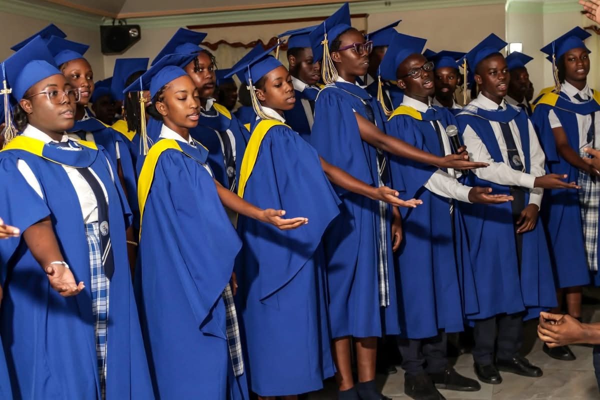 Graduates singing together at commencement